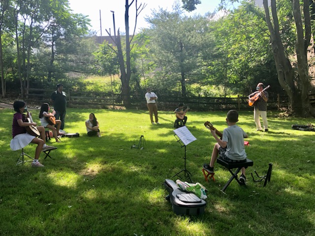Mark outdoor concert wide shot of all students