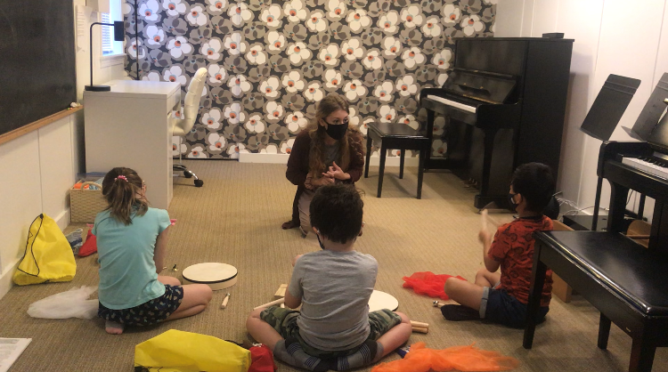 Ms. Maria teaching Musikgarten.