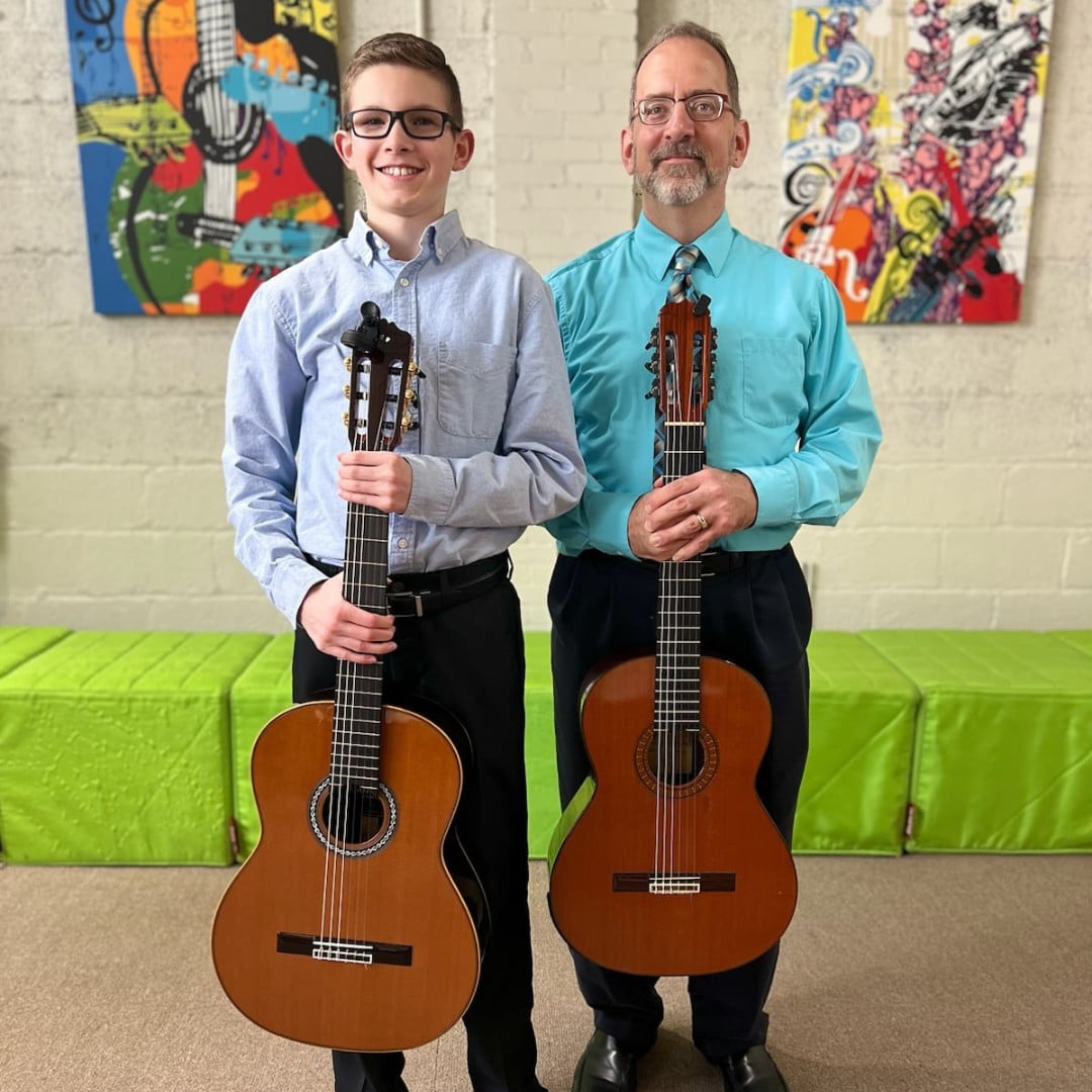 CYM music teacher and guitar student