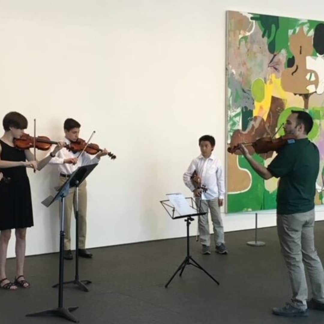 CYM music teacher and violin students