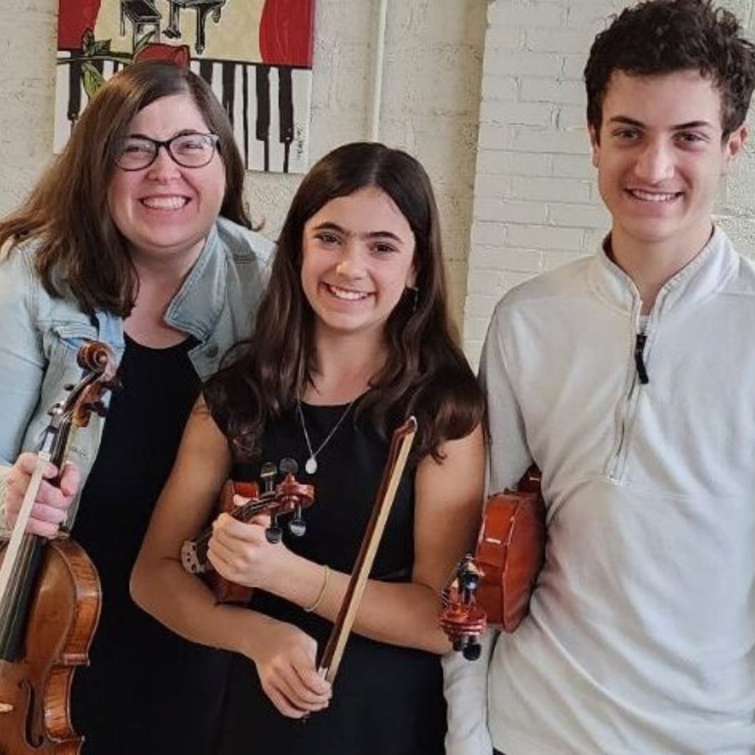 CYM music teacher and violin students